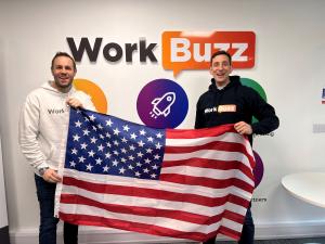Steve Frost, CEO of WorkBuzz holds the American flag with Ben Pearce, Head of Sales U.S