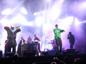 Raekwon, GZA, Ghostface Killa at RZA (in silhouette) onstage @calirootsfest