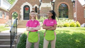 Two Better Life Maids team members smiling in front of a Saint Louis home.