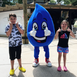 boy and girl with water mascot from Splish Splash with thumbs up