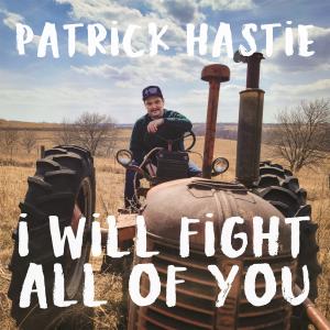 The album cover is a photograph of comedian Patrick Hastie sitting on an old tractor with the words "Patrick Hastie" and "I Will Fight All Of You" written over the photo in white text.