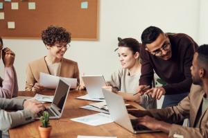 Several people working at a conference table