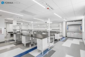 back-to-back workbenches with built-in storage and an integrated fume hood