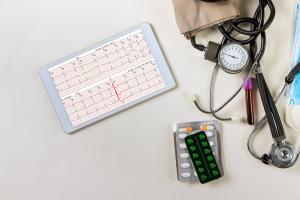 doctor working on heart report analysis