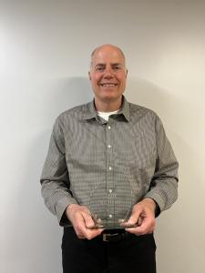 Photo fo Dan Sullivan with the Hall of Fame award.
