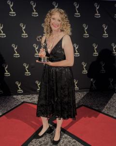 Photo of Filmmaker Melody C. Miller captured the Regional EMMY Award for her documentary, "ruth weiss, the beat goddess."
