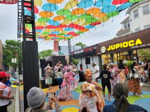 The Flatbush Nostrand Junction BID presents a canopy of umbrellas providing an oasis of shade, vibrancy & fantasy