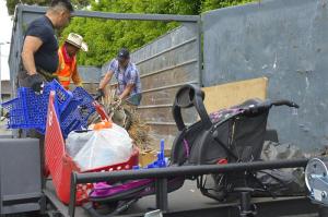 The team filled a container with brush, trash and abandoned belongings.