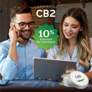 Young male and female couple on an iPad ordering Cannanda CB2 oil. Purchasing through an affiliate link gives buyers a 10% discount.