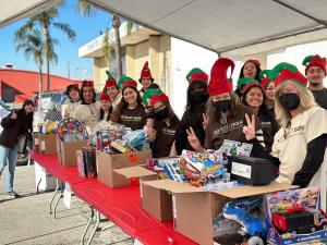 Project Boon volunteers prepare to distribute toys at their 2022 Holiday Giving Event