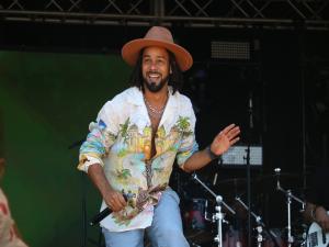 Kees performing onstage at the California Roots Music Festival