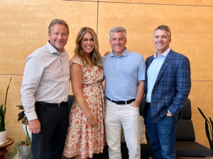 Bret Abbott, Candace Nelson, and Matt Quinn standing beside PARIC Holding's COO Kyle Lopez