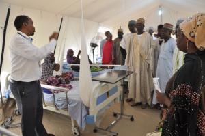 Dr Mohammed Kassim, the Manager of the Stabilisation Centre (left) explaining a point to dignitaries during a tour of the facility shortly after the opening ceremony in Mashamari