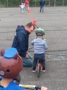 ATSPA staff help young bike rider with road safety tips