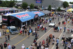 An overhead view of the Summit Racing display with vintage cars and fans surrounding.