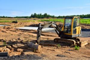 a mini excavator on a construction site
