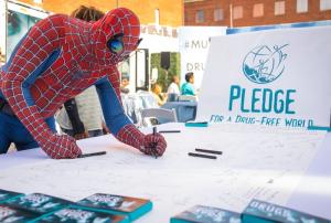 Hollywood Walk of Fame is well known for the buskers who pose for photos with visitors. They too were invited to sign the pledge.