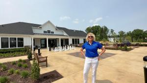 Jolette Reimann with the Clubhouse at Cascades at Embrey Mill