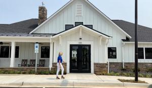 Jolette Reimann with the Clubhouse at Cascades at Embrey Mill