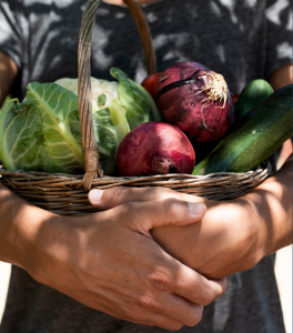 man holding veggies