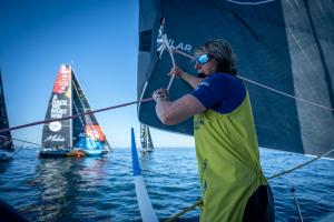 The Ocean Race 2022-23 - onboard Team Holcim - PRB. Abby Ehler assists the unfurl and trim of the J0 on the start line of Leg 6.