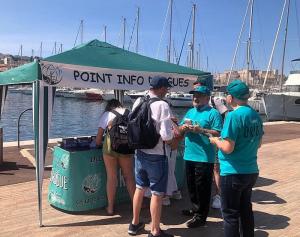 Volunteers manned a booth in Marseilles where they shared this information.