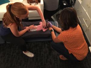 Image of a newborn receiving gentle and effective care from a chiropractor.