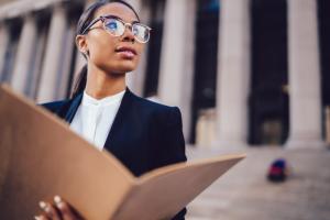 Young Female in front of Court House Free Lawyer Search Directory