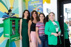 Photography of 4 women posing on the side of Cantinho da Leitura, little library in Redondo Beach.