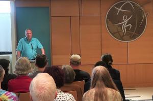  At a drug prevention open house at the Church of Scientology Seattle, Dave Scattergood, Northwest representative of Foundation for a Drug-Free World, briefed those attending on how drug prevention can help resolve the drug epidemic.