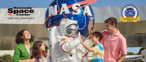 Astronaut high fiving  boy next to his family - photo by PETE BARRETT