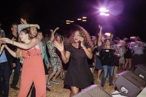 Guests dancing in front of a stage at Best. Party. Ever.