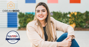 Isabel Sanchez, Founder of Dreamroo, proudly with Dreamroo and NaVOBA logos, representing commitment to excellence, diversity, and empowerment.