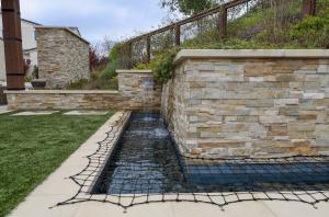covered water feature to protect children and pets from the danger of stepping in