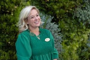 CEO of iLEAD Schools stands smiling in outdoor setting