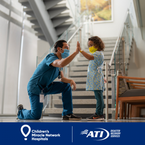 child with hospital staff worker