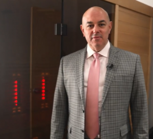 Dr. Frank J. Mandarino praises the health benefits provided by the newly installed sauna at New Jersey Sports Chiropractic in Morganville, N.J.