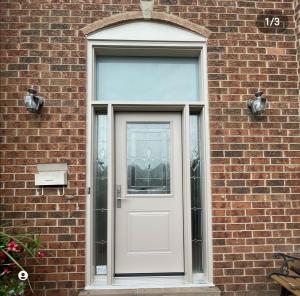 Double fiberglass door with transom Multi point lock Entire door stain in and out