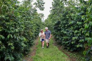 Steve and Joanie Wynn walking together on their coffee farm
