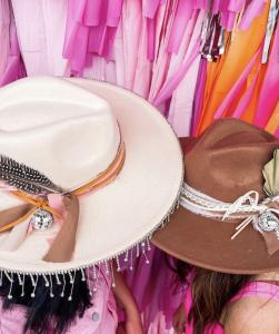 A set of light tan and brown hats personally designed during a Hat Bar Party at dWELLing Home Decor & Apparel