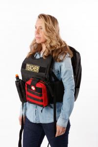 Teacher wearing bulletproof backpack
