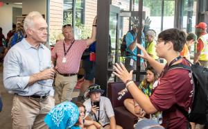 Scott Pelley of CBS discusses Ketherine Frost's Eagle project during the 2023 National Scout Jamboree at The Summit Bechtel Reserve in Mount Hope, West Virginia. (BSA Photo by Dave Doty)