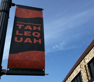 City of Tahlequah, Oklahoma flag outside newly renovated Provalus facility in rural downtown.