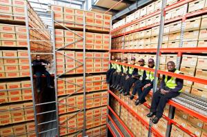 Crown Relocations Kenya removal men taking a break on shipping crates
