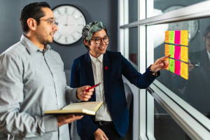 Firm Media's Creative Director Jaycie Kim, and Lead Designer Bryan Figueroa during their weekly design meeting.