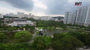 A ‘Zerolap’ drone made by this is engineering Inc. delivers goods over Tancheon stream, Bundang.