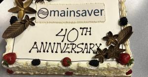 Cake with Mainsaver 40th anniversary and company logo