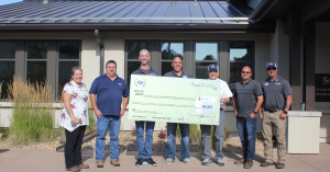 HEI Civil employees present DCVMF with check from Charity Golf Tournament