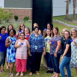 Photo of teachers with their donation gift cards