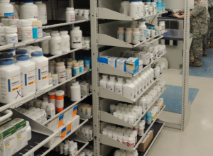 A Military pharmacy with two individuals in Uniform